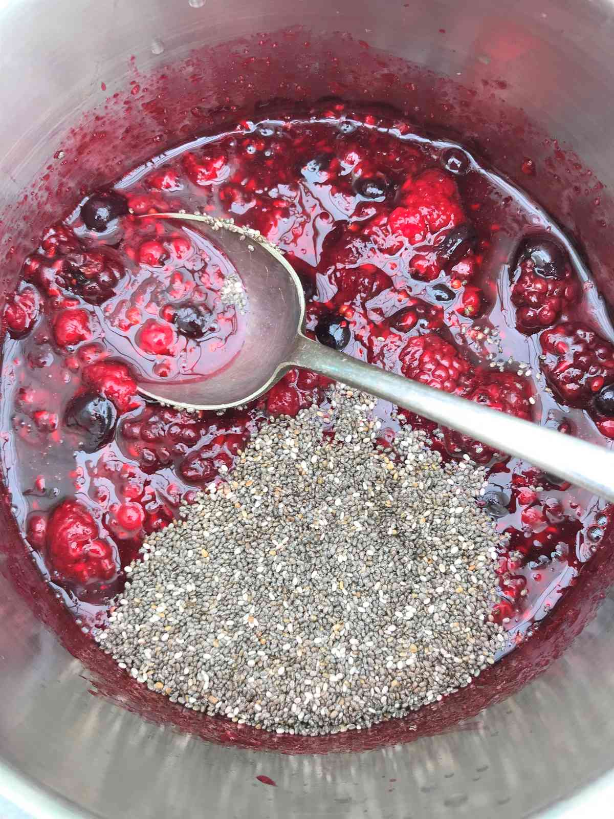 Adding chia seed to quick homemade jam.