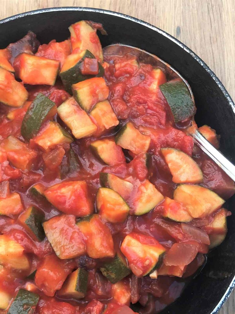Courgette and tomato sauce cooked in frying pan