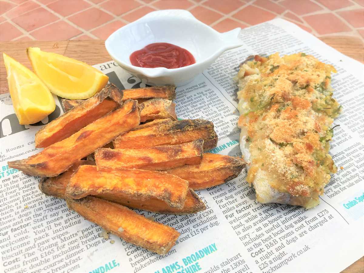 Healthy fish and chips on newspaper