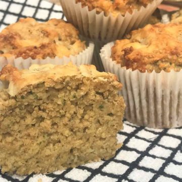 Cheese and courgette muffins on checked cloth
