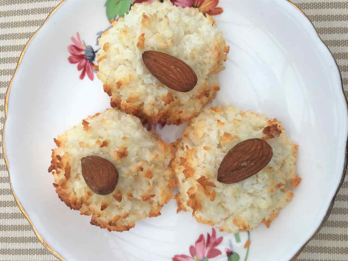 Healthy coconut macaroons on flowered plate.