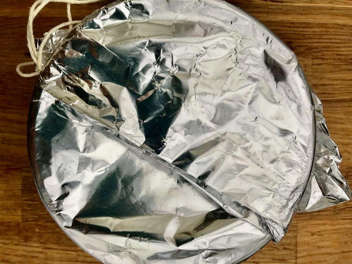 Foil topped bowl for steamed Christmas pudding