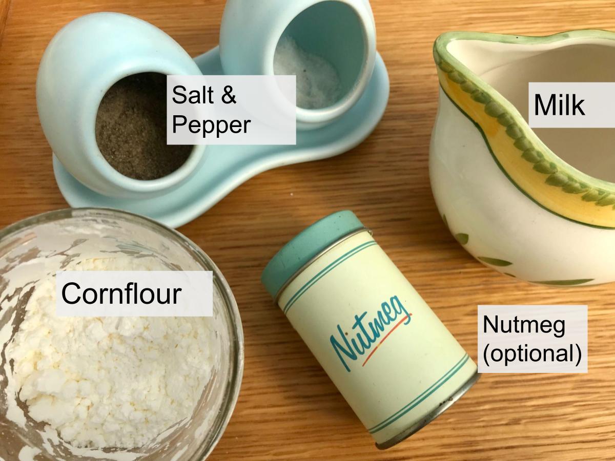 Ingredients for white sauce - milk, cornflour and seasoning