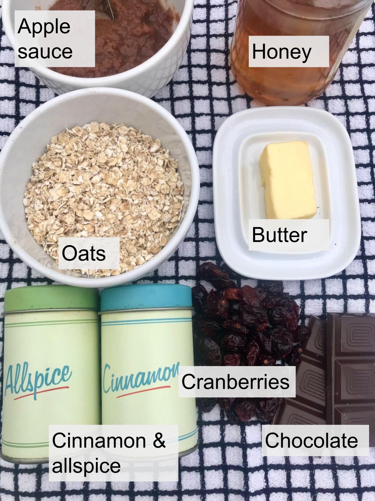 Oats, applesauce, butter, honey, cinnamon, allspice, cranberries, dark chocolate.