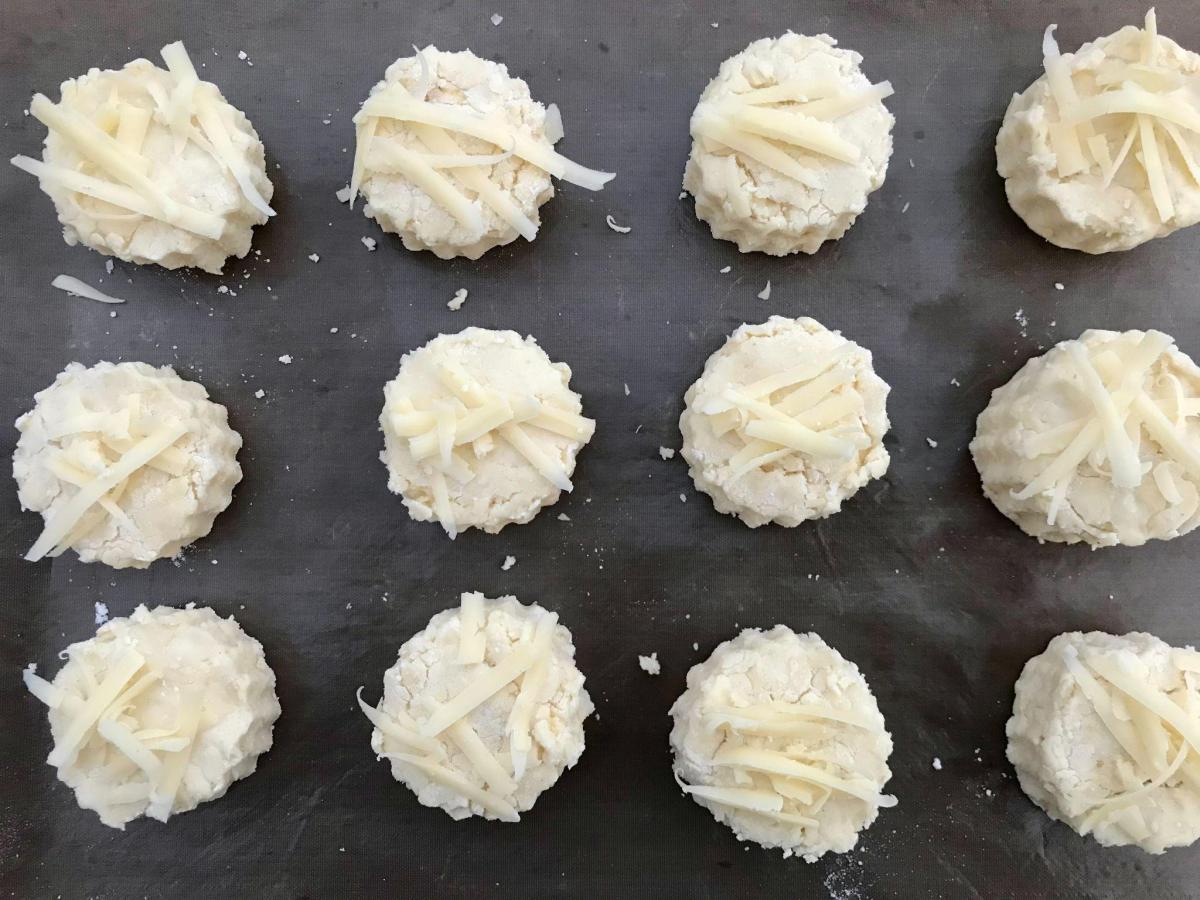 Cheese scones on tray ready for baking. 