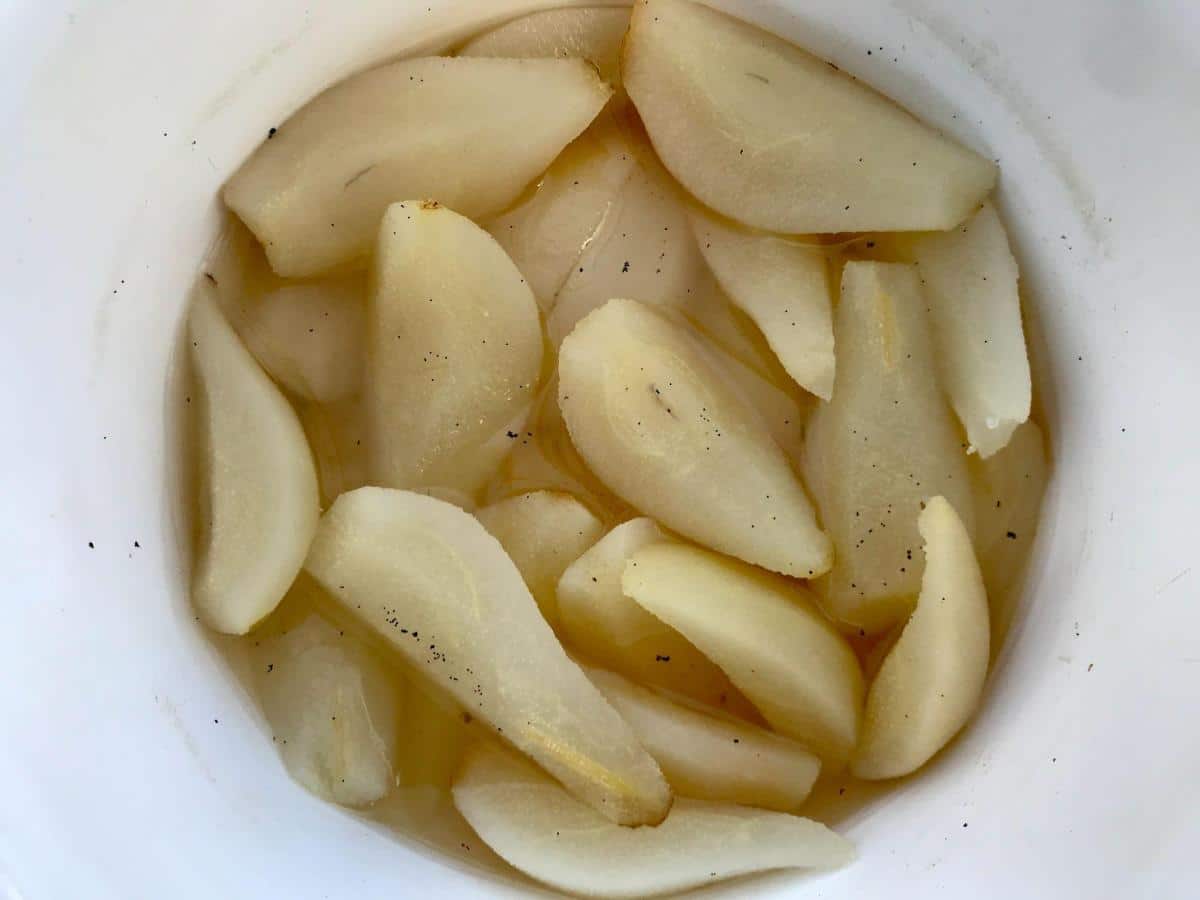 Pears cooked with vanilla in pan. 