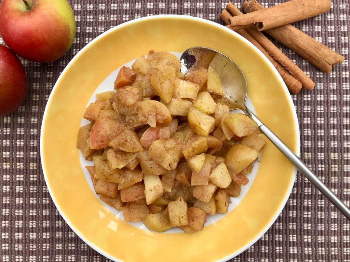 Healthy stewed apple in yellow bowl