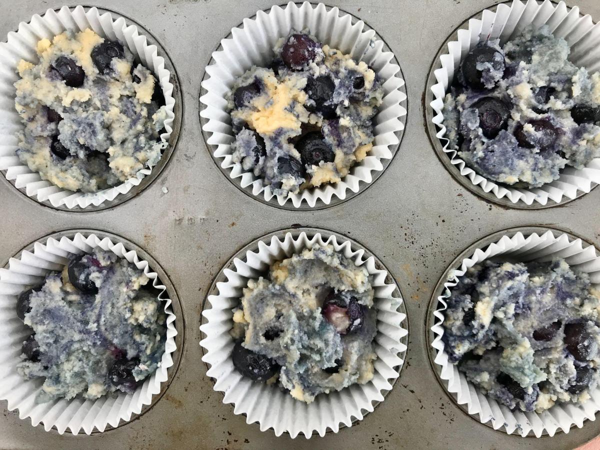 GF blueberry muffin mixture in tin