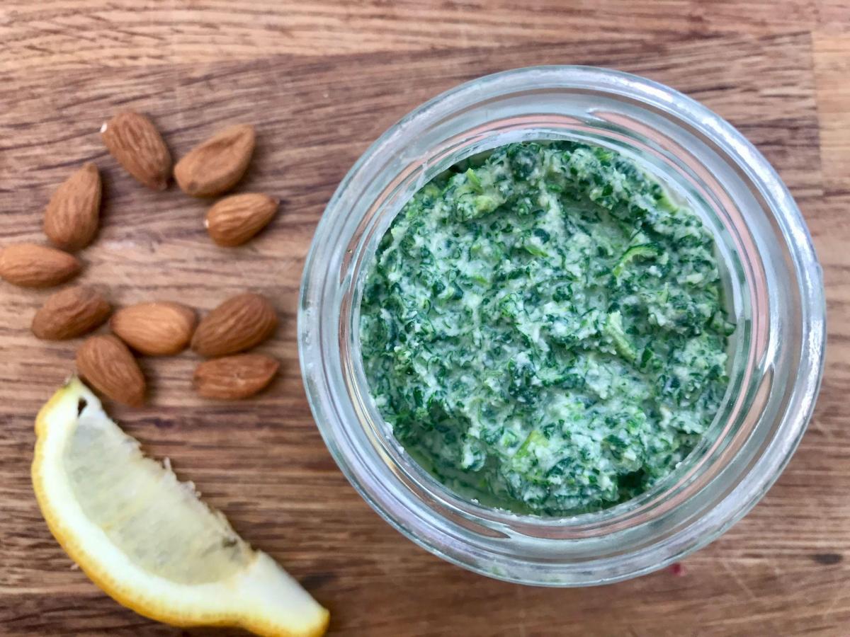 Nettle pesto in jar with lemon and almonds