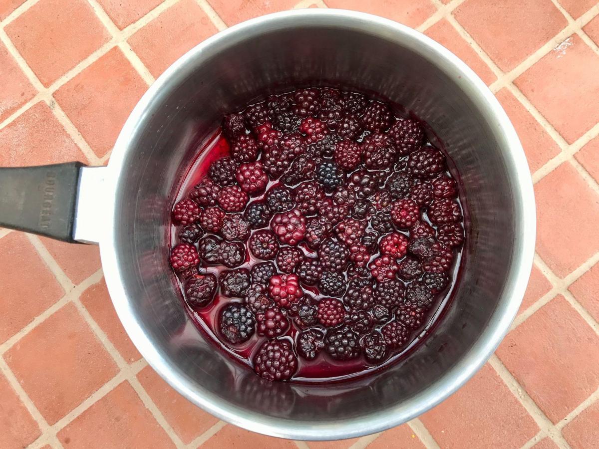 Cooked blackberries in pan