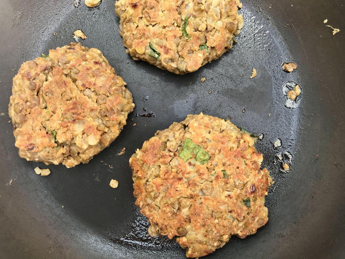Cooked lentil burgers in pan