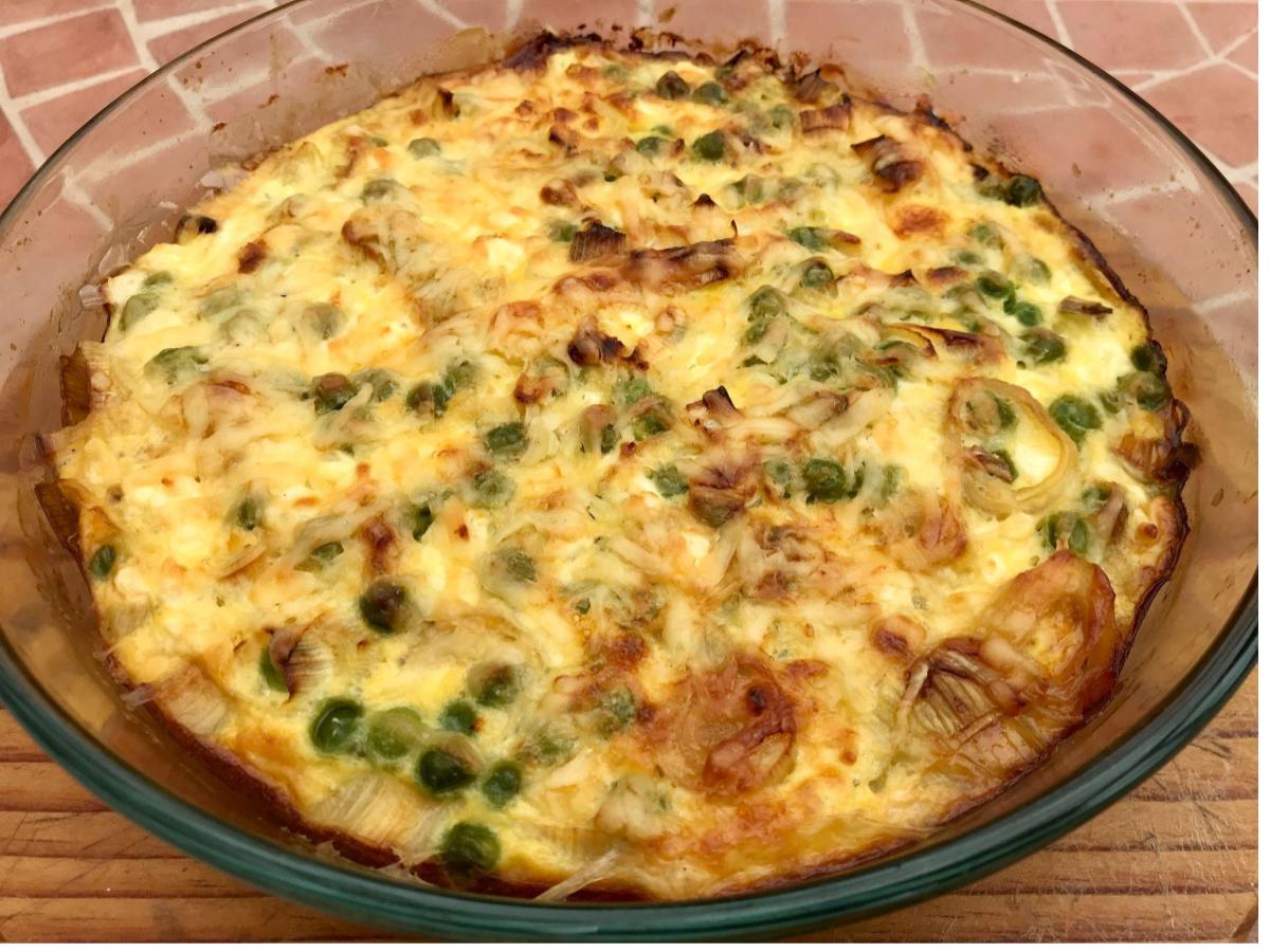 Cooked low fat quiche in pie dish