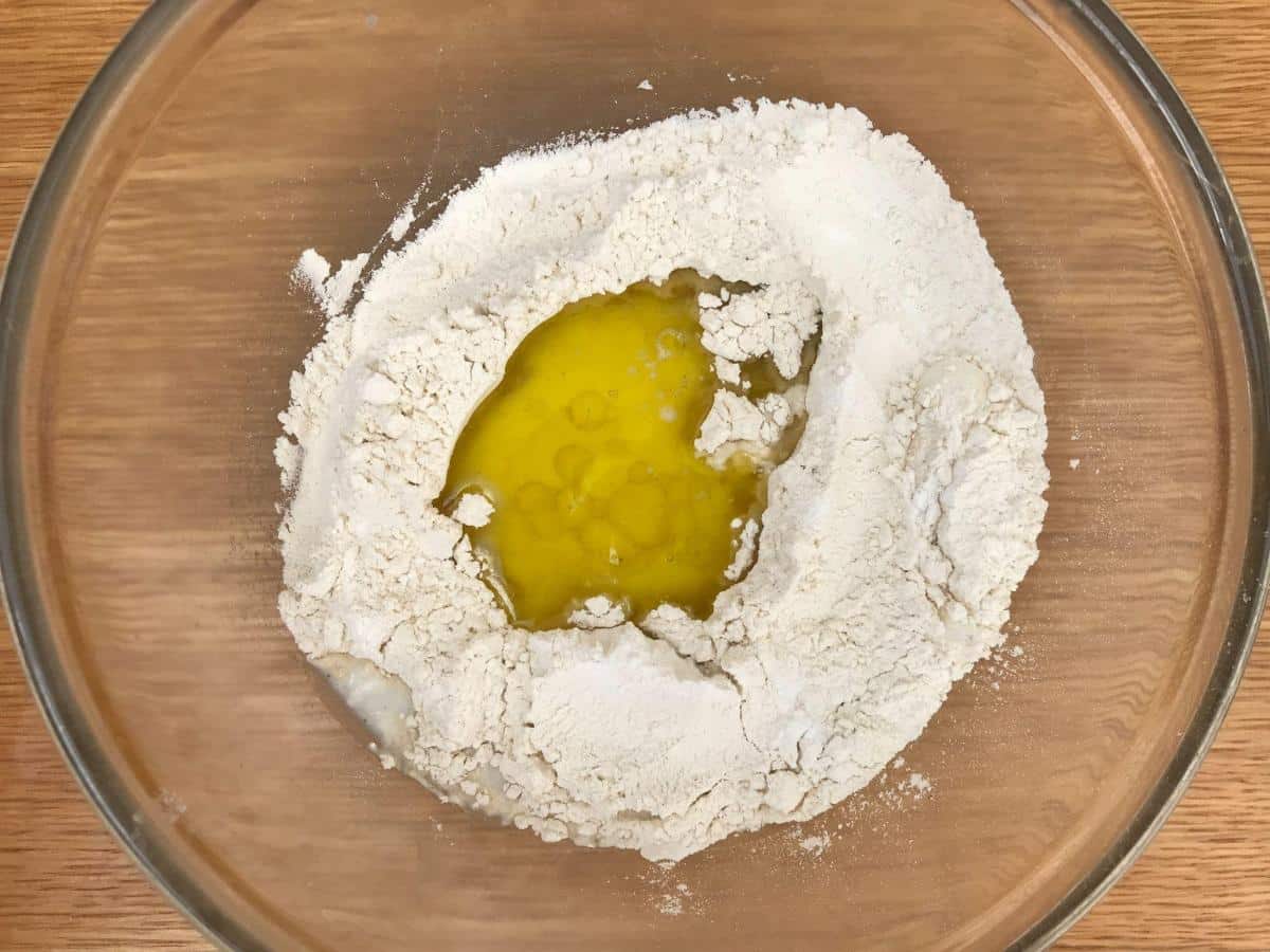 Flour, olive oil and milk in bowl