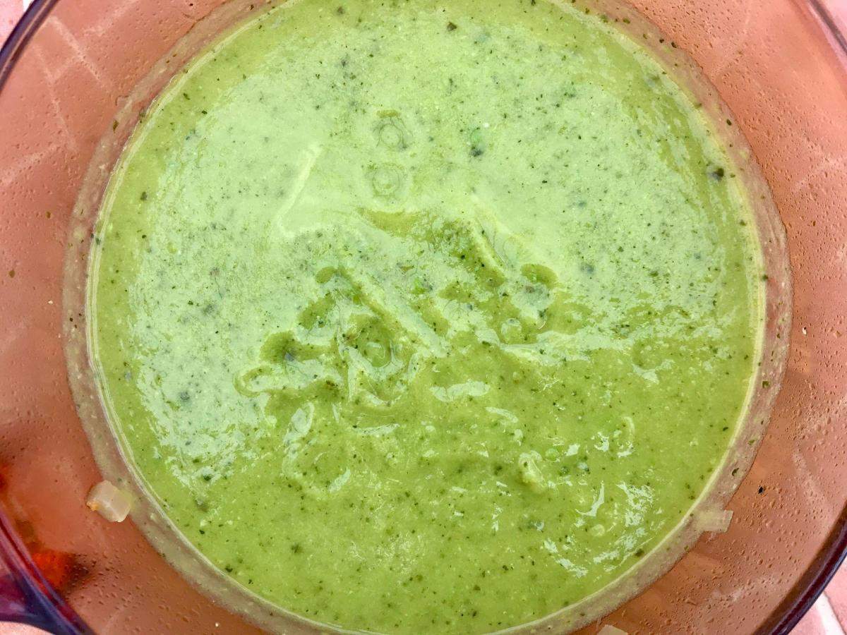 Pea and courgette soup blitzed smooth in pan