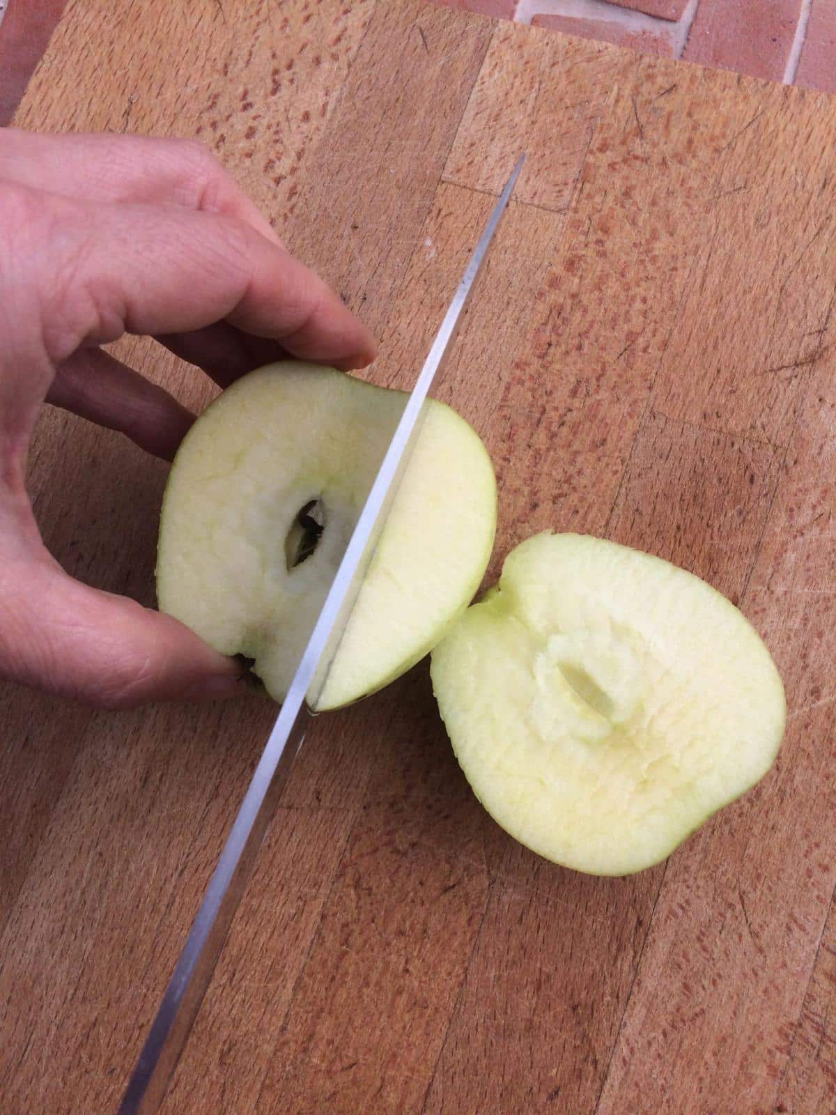 Preparing apples second cut.