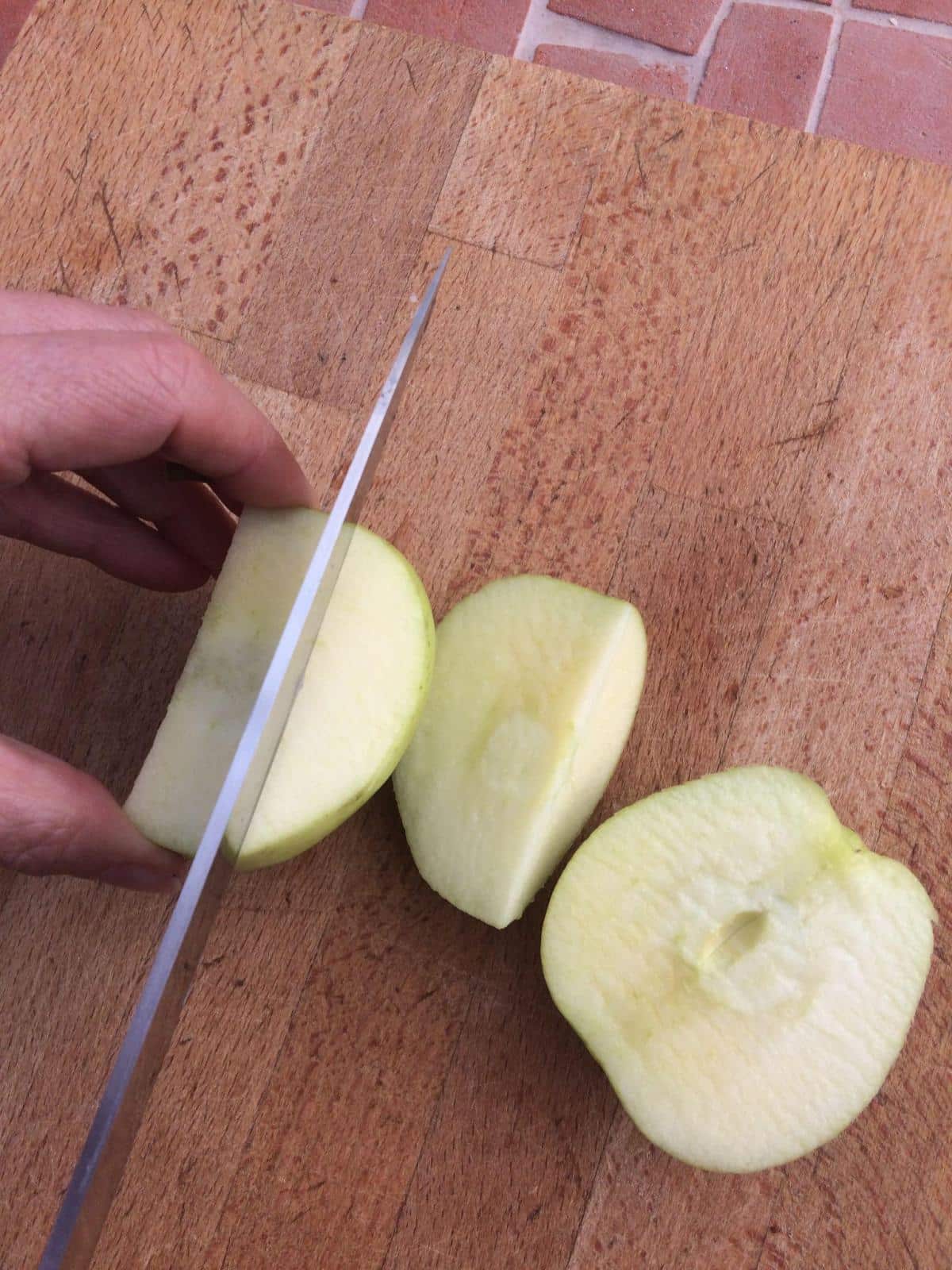 Third cut preparing apples.