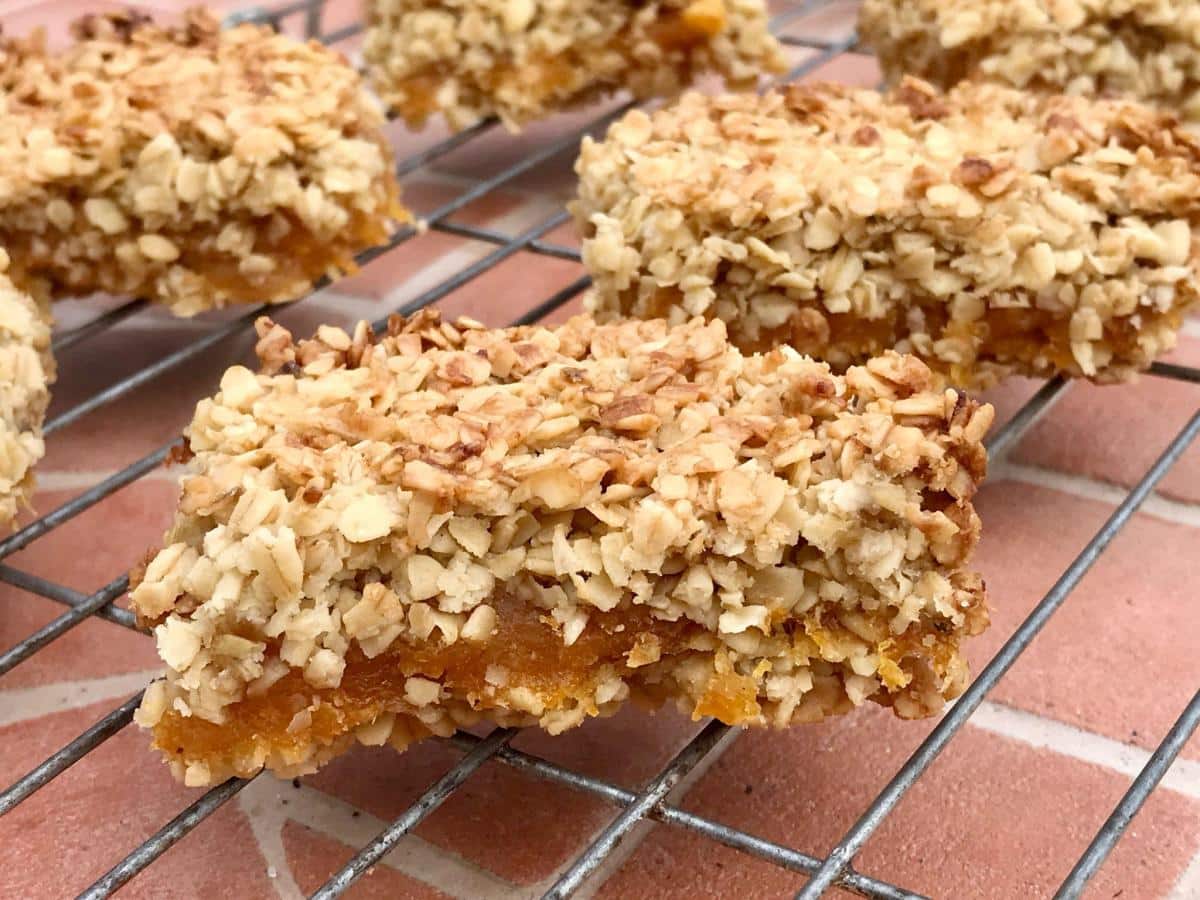 Apricot oat slice on wire rack.