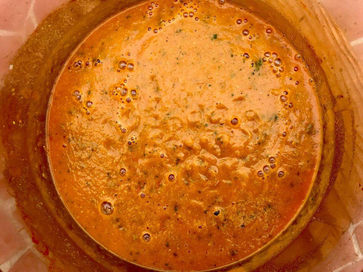 Blitzed red lentil soup in pan.