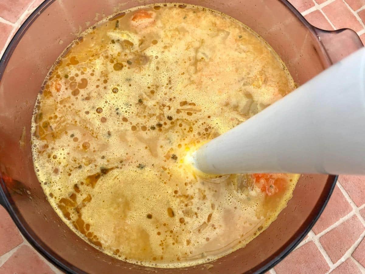 Blitzing soup in pan.