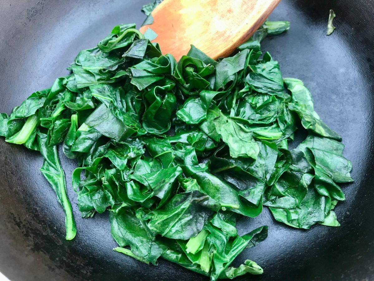 Saute perpetual spinach in pan.