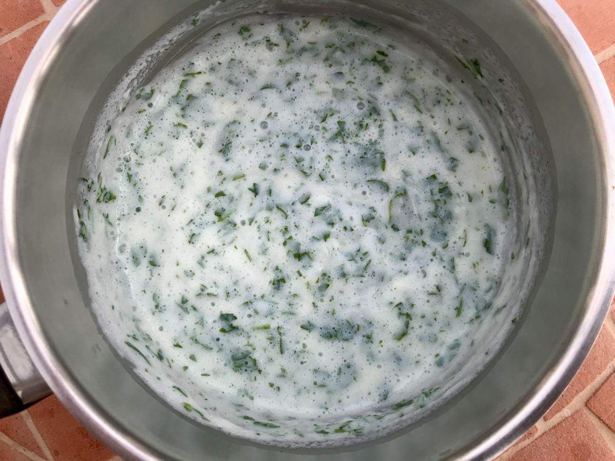 Gluten free parsley sauce in pan.