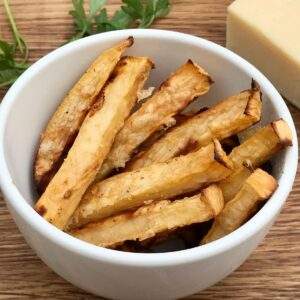 Swede chips in bowl with parmesan.