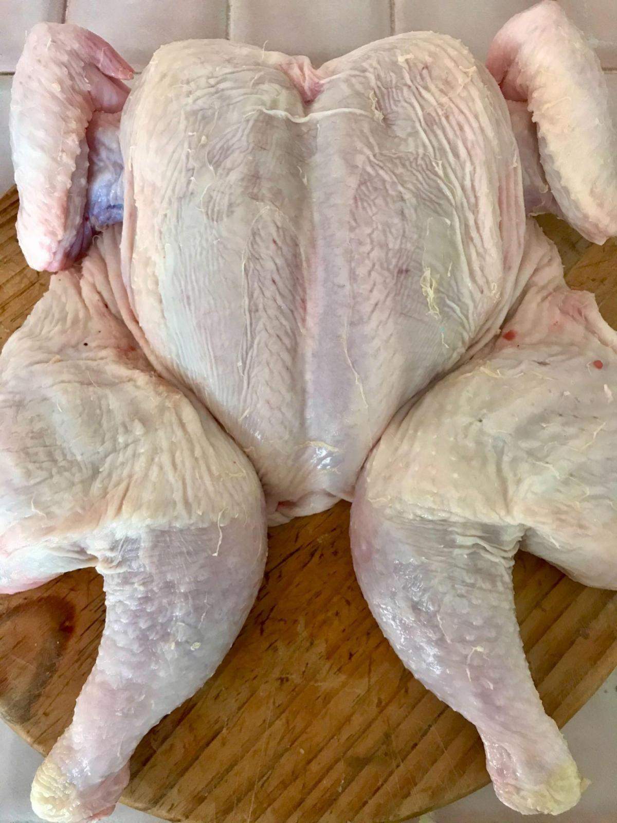 Flattened chicken breast side up.