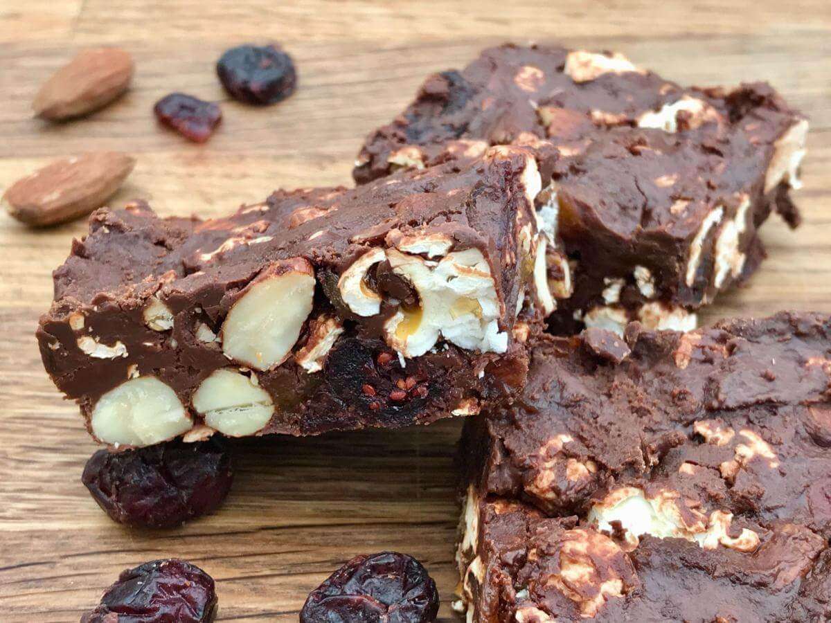 Healthy rocky road bars on board with cranberries and almonds.