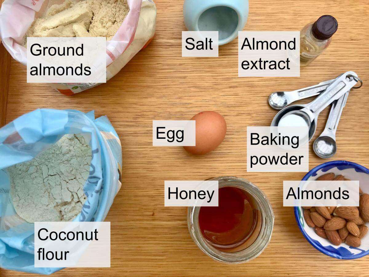 Ground almonds, whole almonds, coconut flour, egg, honey, baking powder, almond extract, salt.