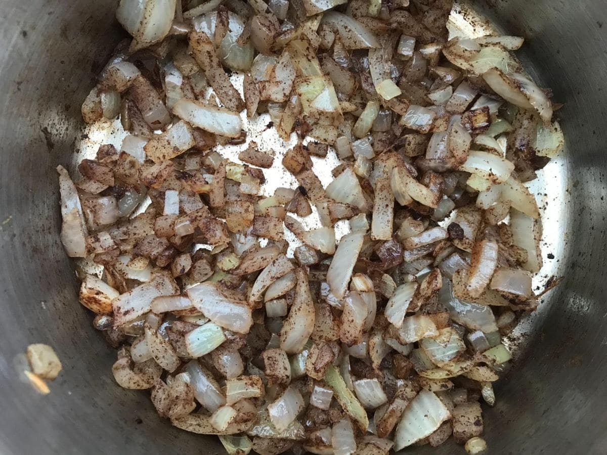 Onions and spice in pan.