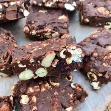 Pile of rocky road bars on baking paper.