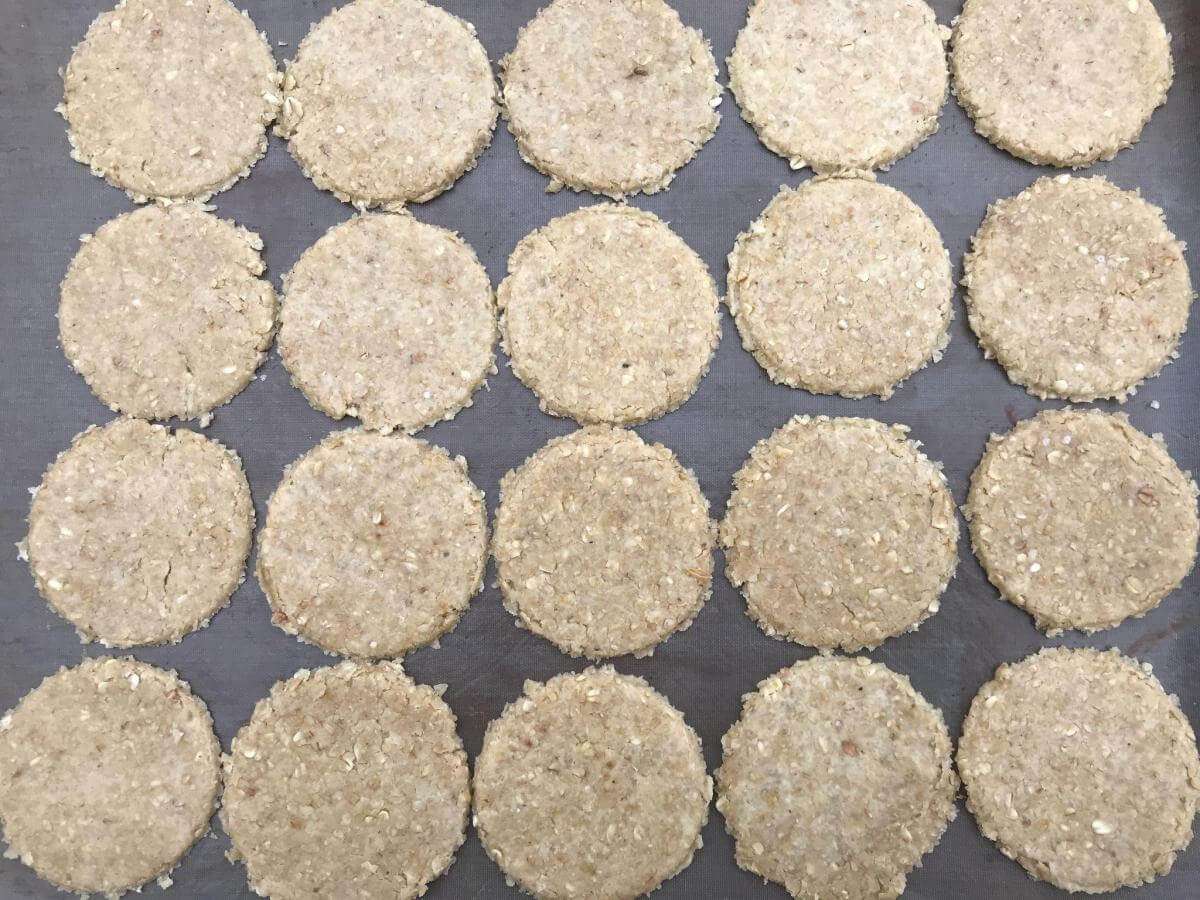Raw GF oatcakes on baking tray.