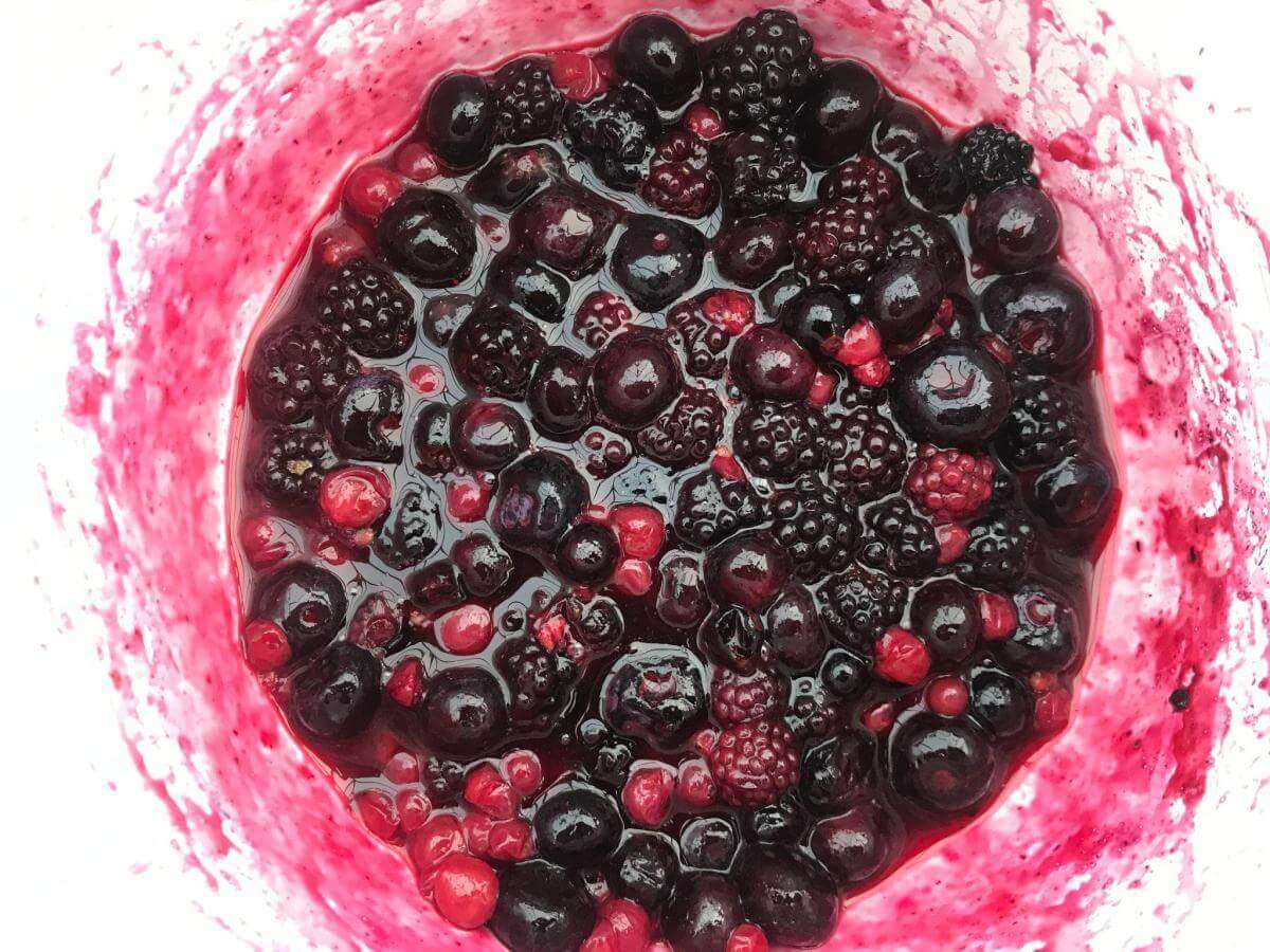 Berries and sugar in pan.