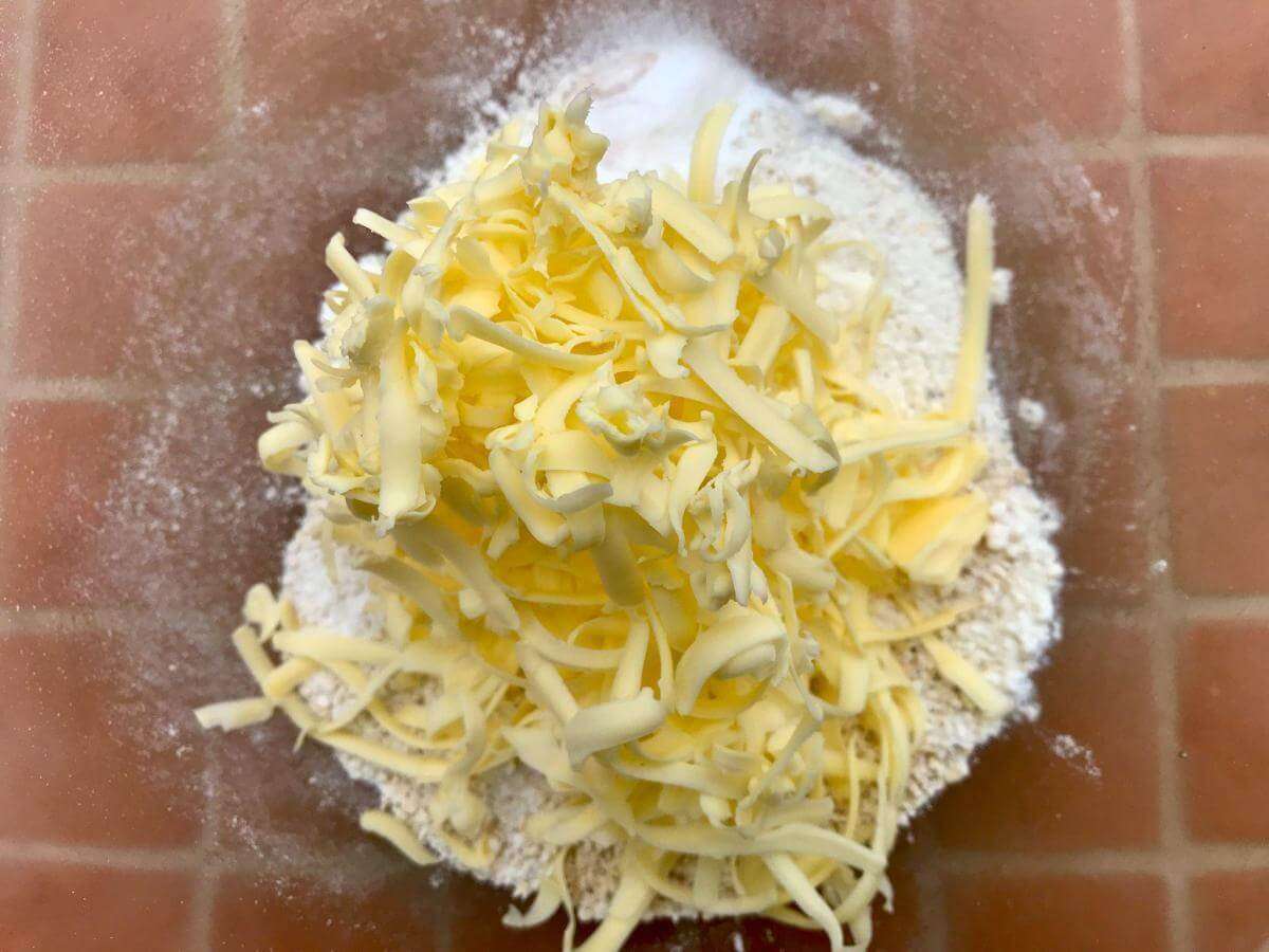 Grated butter on top of GF flour.