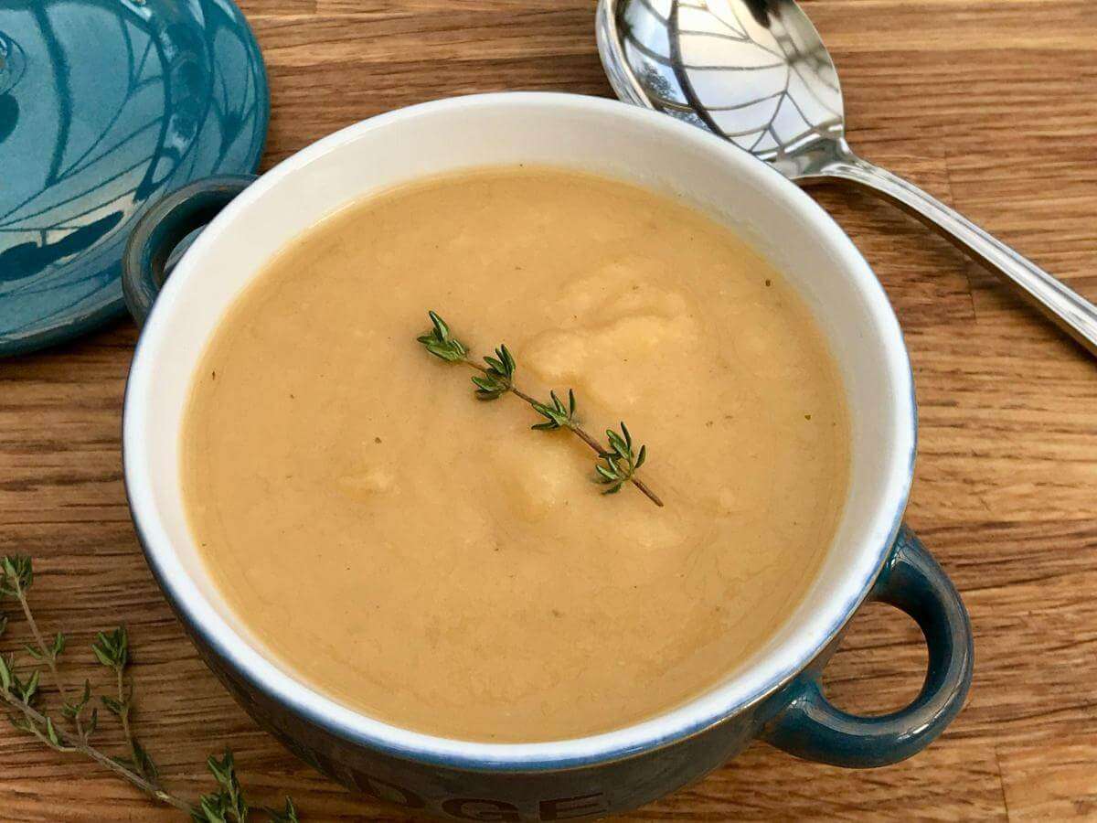 Swede and parsnip soup with spoon.