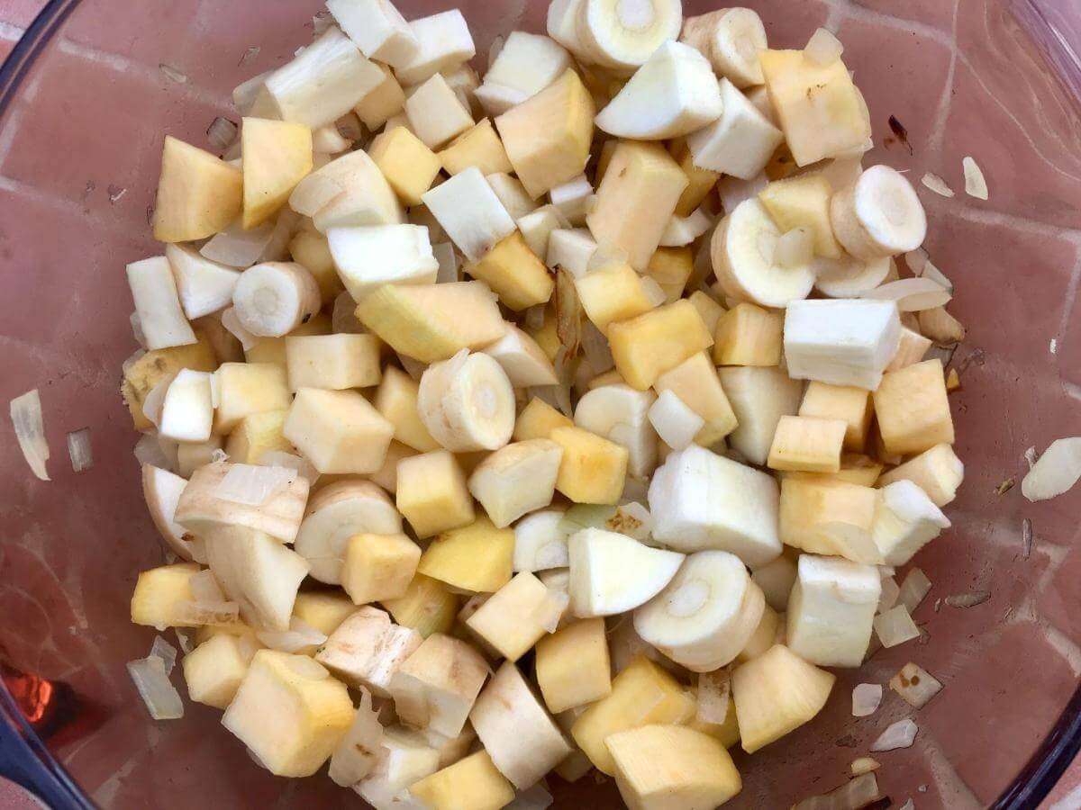 Swede parsnip and onion in pan.