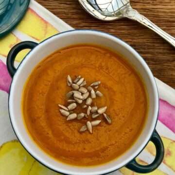 Carrot and swede soup with sunflower seeds.