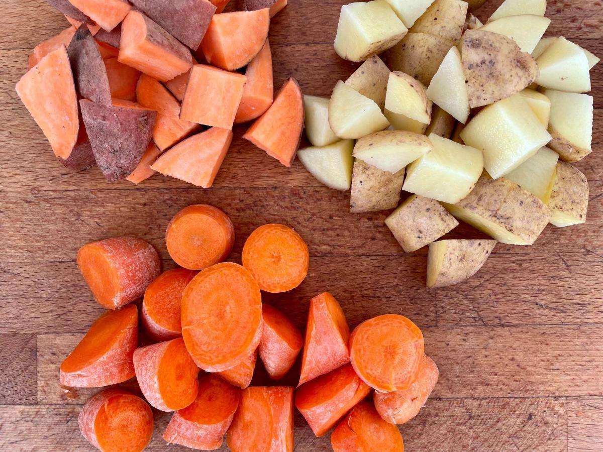 Chopped sweet potatoes, potatoes and carrots.