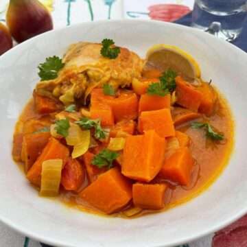 Healthy slow chicken curry in white bowl.