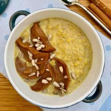 Spiced porridge with turmeric in bowl.