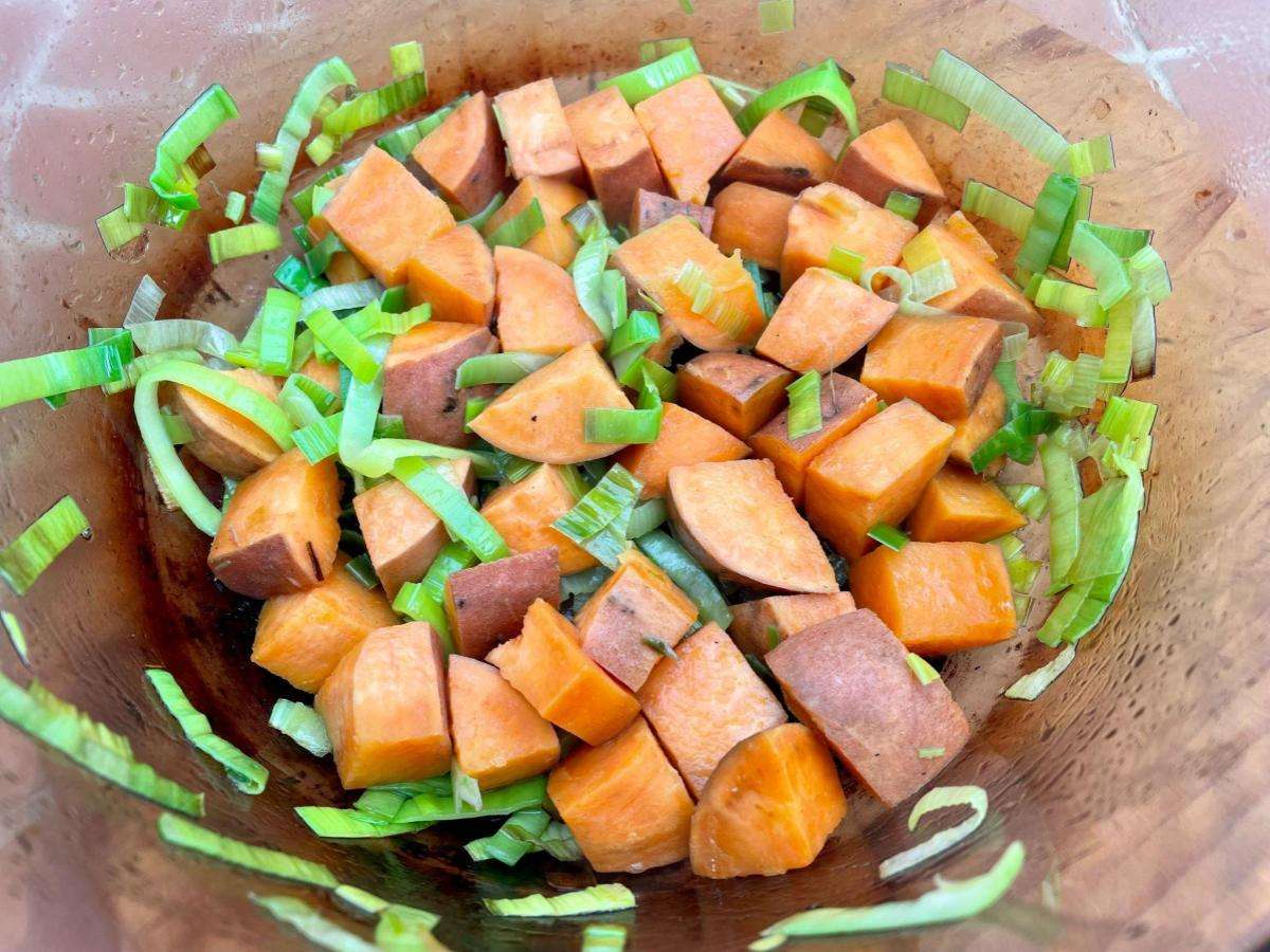 Sweet potato and leek in pan.