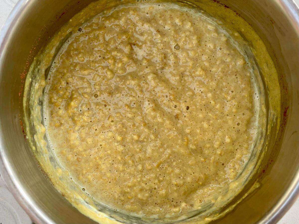 Turmeric porridge in pan.