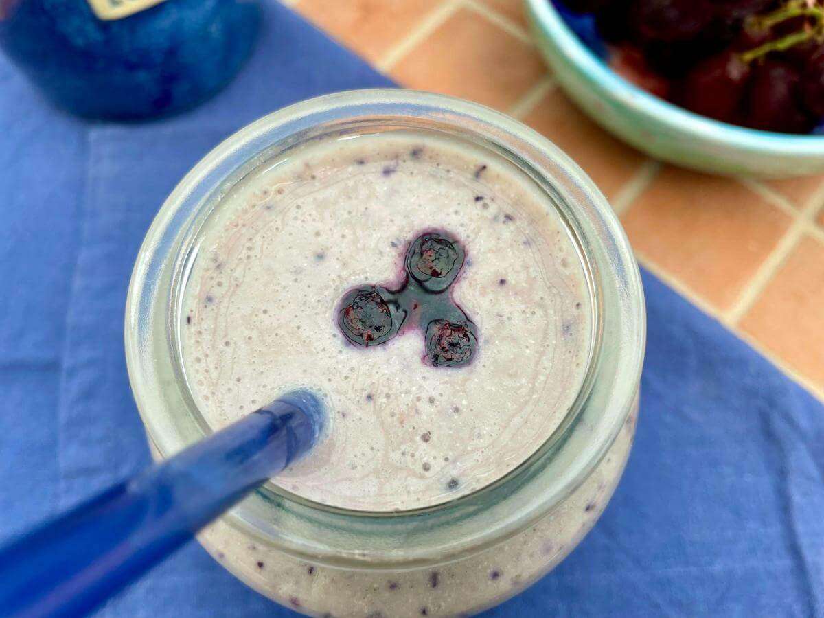 Blueberry cottage cheese smoothie in glass.