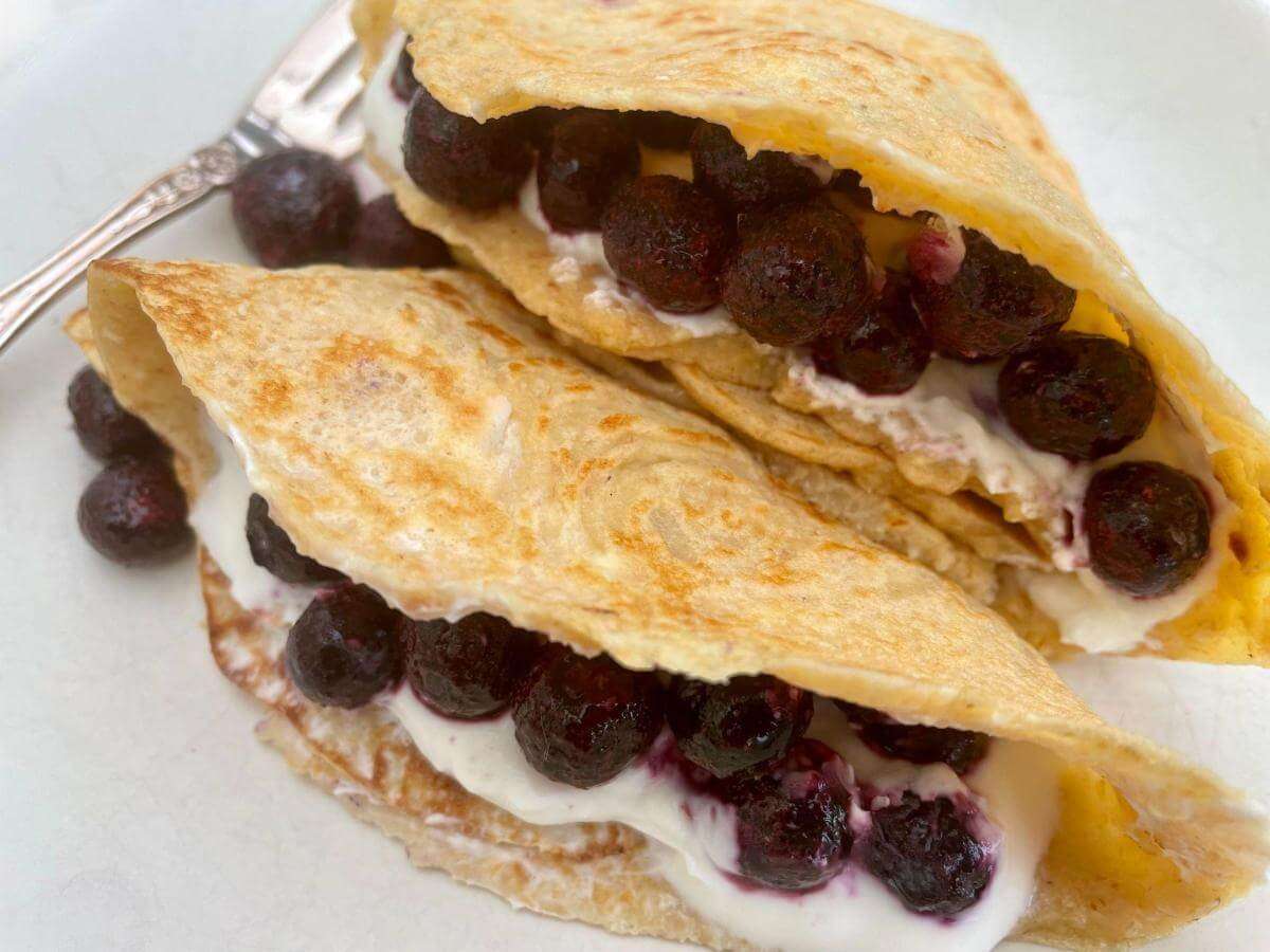 Stack on oat flour crepes on plate.