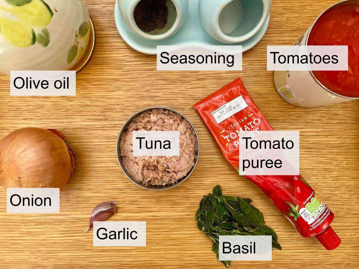 Tuna, tomatoes, tomato puree, onion, garlic, olive oil, seasoning and basil.