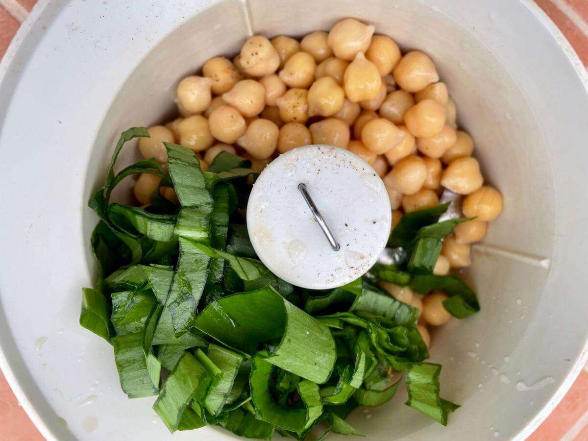 Chickpeas, ramps and olive oil in food processor.