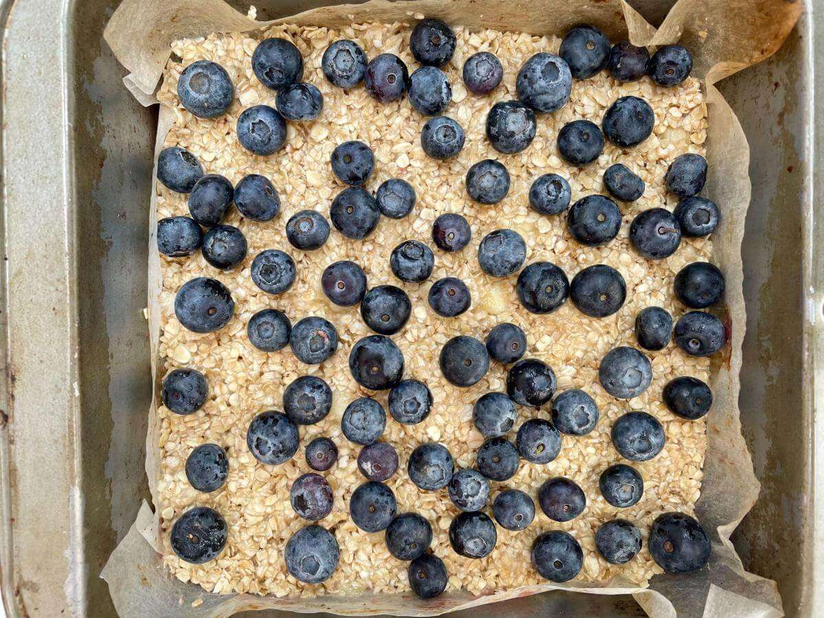 Blueberries on flapjack mixture.
