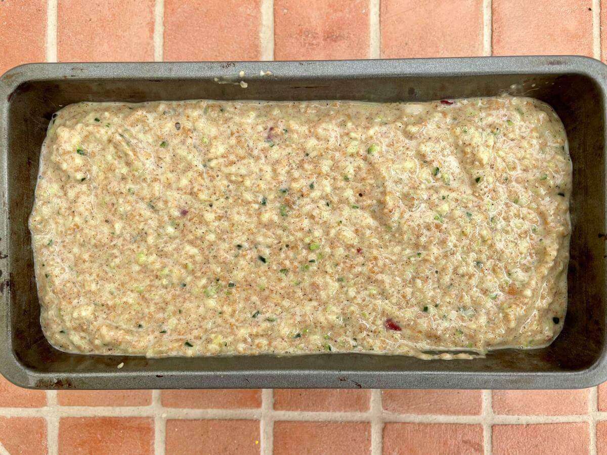 Courgette cake mixture in loaf tin.
