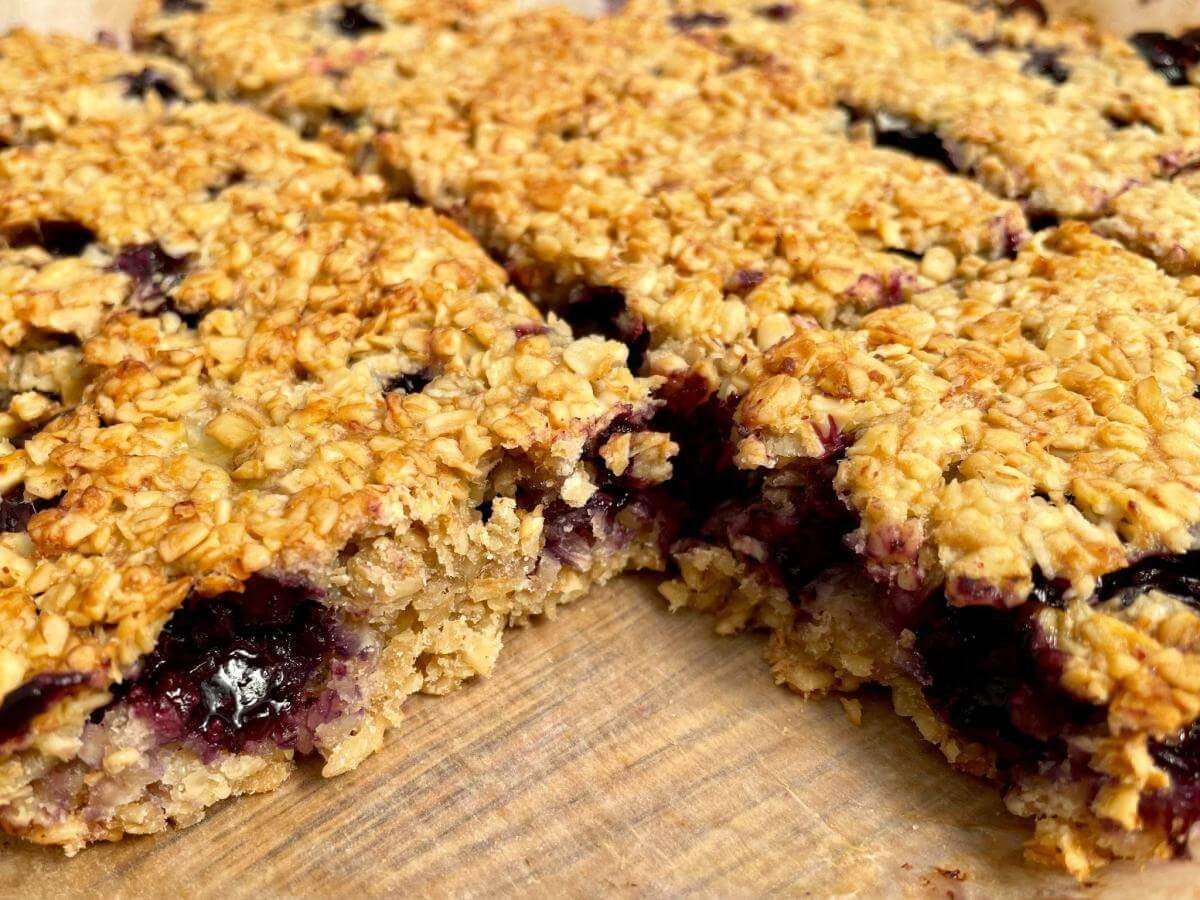Squares of flapjacks with blueberries.