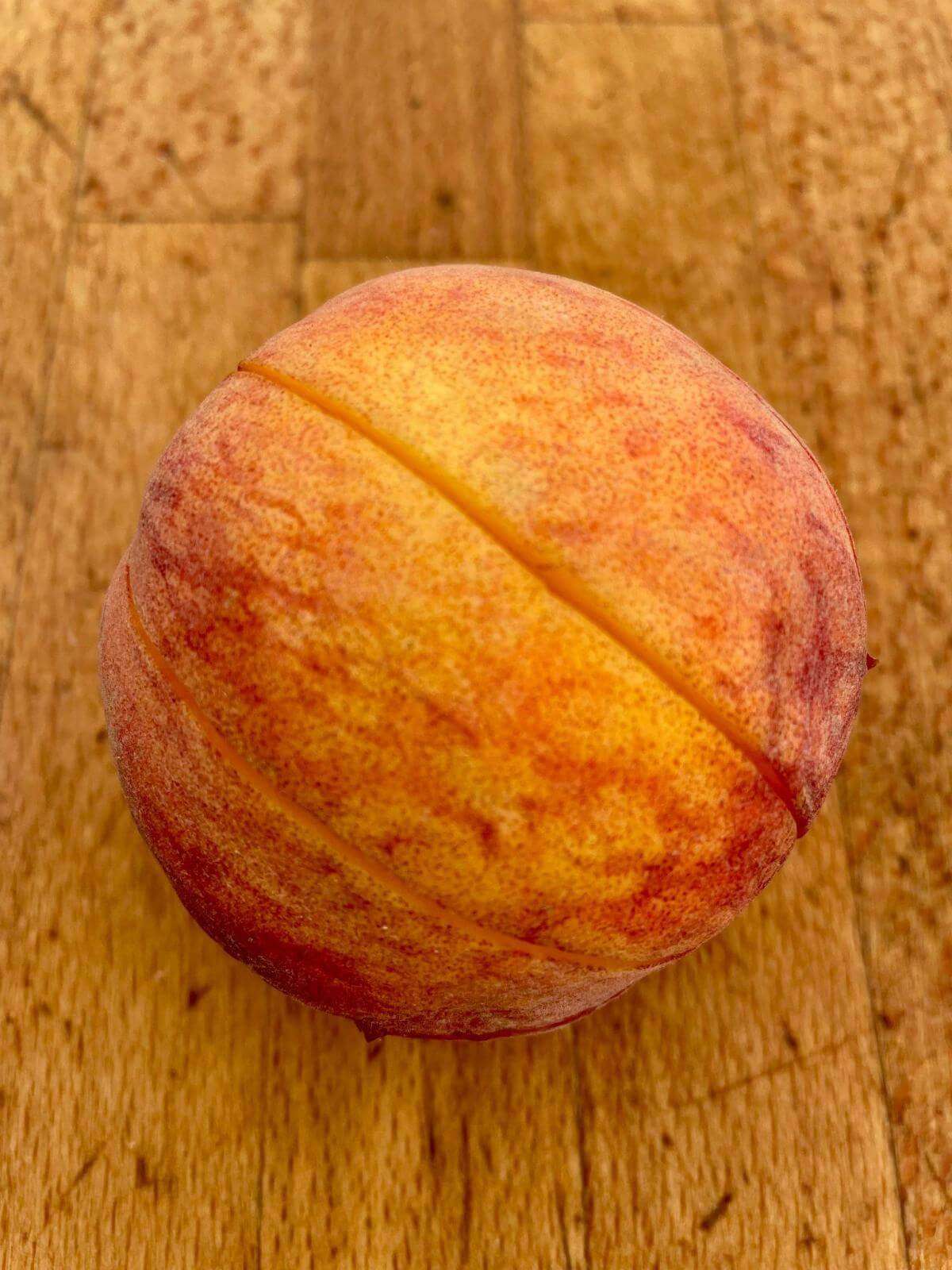 Whole peach cut in segments.